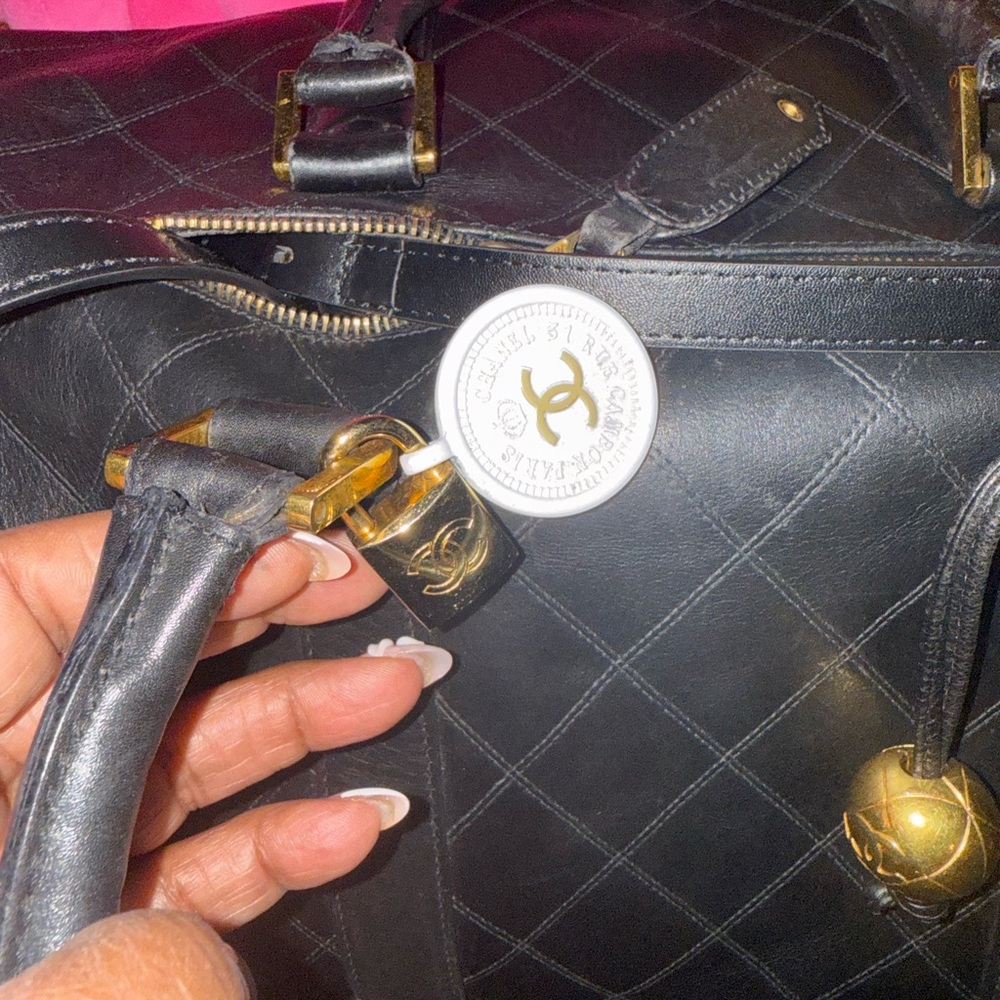 CHANEL Black Quilted Tote with Gold Accents